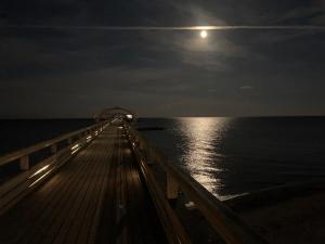 a deck of a ship in the ocean at night at Schlafstrandkorb Nr 5 in Kellenhusen