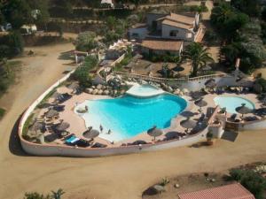 an aerial view of a pool at a resort at ZEcamping 3 étoiles à 1km de la plage piscine jacuzzi animaux acceptés in Viggianello