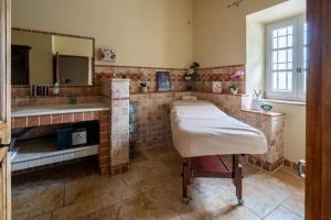 a bathroom with two sinks and a mirror at Mas Loisonville - 32 couchages in Grillon +37 photos