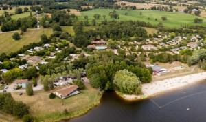 an aerial view of a small island in the water at ZEcamping 4 pet friendly piscine couverte et parcours Fitness in Pressignac