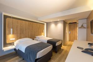 Postelja oz. postelje v sobi nastanitve M Hotel + 37 fotografij