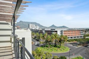 a balcony with a view of a street and buildings at Colosseum Hotel in Cape Town