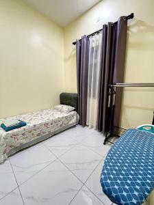 a room with two bunk beds in it at dayah homestay in Siputih