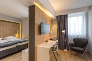 TV a/nebo společenská místnost v ubytování M Hotel