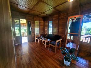 a living room with a couch and a table at 361 Alam in Tetebatu