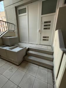 a room with stairs leading to a door at AG Wohnung Fellbach Nr 3 in Fellbach
