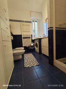 a bathroom with a toilet and a sink at La place du Coeur in Pont-Saint-Martin +38 photos