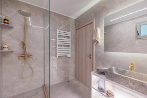 a bathroom with a shower and a sink at Angel House in Ialysos +22 photos