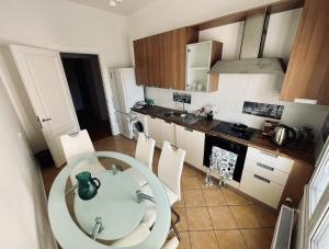 a kitchen with a table and chairs in a room at Spacious 2 bedroom apartment, Old Town Riga in Riga