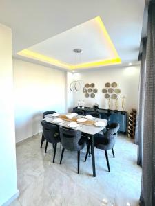 a dining room with a table and chairs at Premium Homes in Didim +21 photos