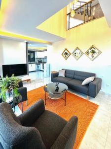 a living room with two couches and a table at Premium Homes in Didim
