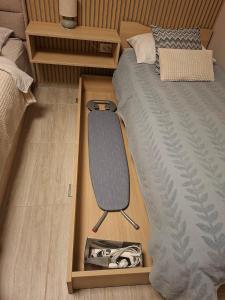 a room with a bed with a desk next to it at Lavanda & limone in Koper
