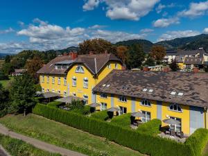 an overhead view of a large yellow house at Das Karl August in Fohnsdorf