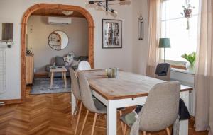 a dining room with a table and chairs at Awesome Home In Sölvesborg With Wifi in Sölvesborg