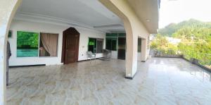an empty hallway of a house with a balcony at Koh E Sukoon Apartments in Patriata