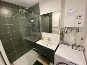 a bathroom with a sink and a shower at Duplex 3 chambres Etoile du sud in Le Lioran +36 photos