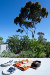 a tray of food on a table with a plate of food at Dunkeld Secret Garden in Dunkeld +38 photos