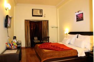 Voodi või voodid majutusasutuse Hotel Hong Kong Inn toas