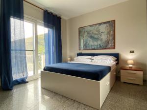 a bedroom with a bed and a large window at Villa Mariposa exclusive private pool in Budoni +52 photos