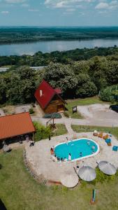 an aerial view of a swimming pool and a cabin at Laguna Platz in Sremski Karlovci +45 photos