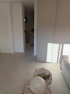 a living room with a couch and a table at Studio Noélie in Antibes