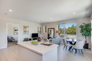 a kitchen and living room with a table and chairs at Realm in Menlo Park