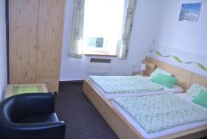 Posteľ alebo postele v izbe v ubytovaní Apartmány Růže
