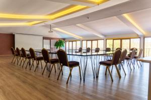 a meeting room with a long table and chairs at Green House Garden Park Hotel in Istanbul +83 photos