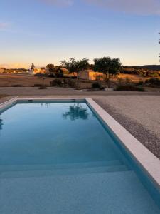a swimming pool in the middle of a road at Les Eres de Palouet- Casa de campo con piscina privada in Palouet