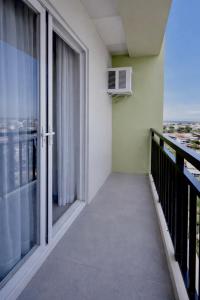 a balcony with a view of a city at Ocean View Studio Iloilo in Iloilo City