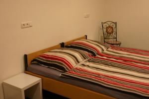En eller flere senge i et værelse på Ferienwohnung mit Herz für Tiere