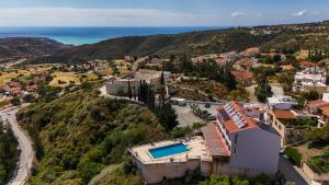 an aerial view of a house with a swimming pool at Pissouriana hotel Apartments in Pissouri