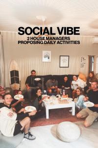 a group of people sitting in a living room at Banama Surfhouse - Coliving Coworking & Yoga in Corralejo