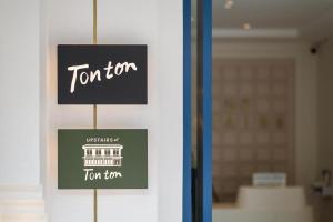 a sign on a door of a room with a function at Upstairs at Ton Ton in Bangkok