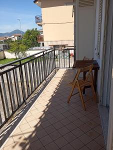 a porch with a bench on a balcony at Casa Isotta in Fondi