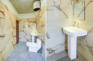a bathroom with a sink and a toilet at Hotel Namaste Pushkar in Pushkar