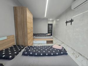 a room with two beds in a room at Icon Residence in Sofia