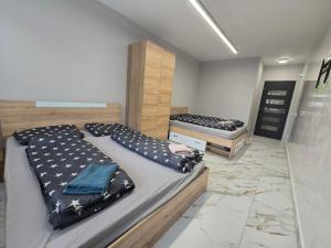 a room with two beds in a room at Icon Residence in Sofia