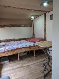 a room with two beds in a room at La Maison de Hobbit in Lafarre +2 photos