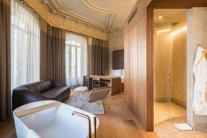 a living room with a bath tub in a room at Mercer Madrid in Madrid +69 photos