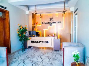a reception area of a hotel with a marble floor at RIVANA HOTEL Goba in Dar es Salaam