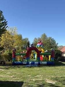 a colorful play structure in the grass at camping de la mottelette in Forest-Montiers