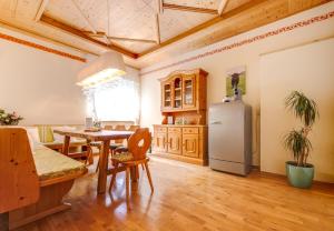 a kitchen with a table and a refrigerator in a room at Apartment Gabriel in Melk +6 photos