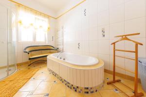 a bathroom with a large tub in a room at Apartment Gabriel in Melk