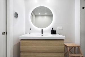 a bathroom with a white sink and a mirror at Casa Pedro Santa Clara in Torremolinos +12 photos
