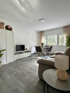 a living room with a couch and a table at el AS del Puntal in Villaviciosa