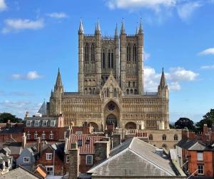 a large cathedral in a city with buildings at The Nook Lincoln in Lincolnshire
