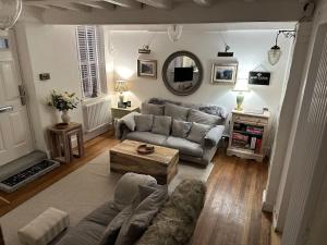 a living room with a couch and a table at The Nook Lincoln in Lincolnshire