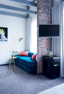 TV a/nebo společenská místnost v ubytování Five Rooms