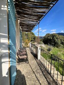 a row of chairs sitting on a balcony at Charming apartment in Nyons in Nyons
